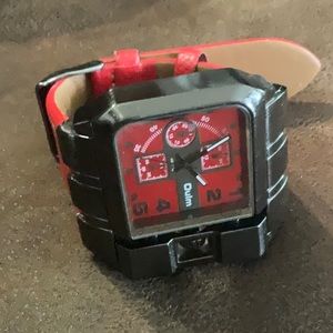 Watch /red and brown /brand is QULM